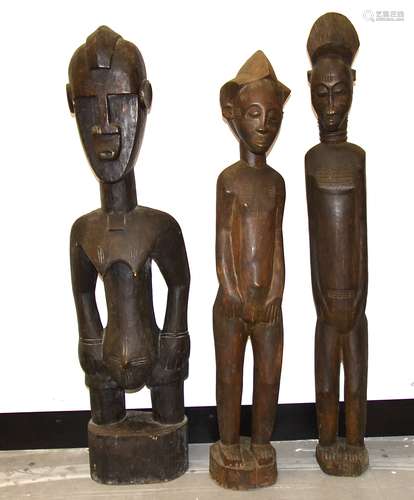 Two Baule figures and a Senufo figure, Ivory Coast, tallest 100cm (3)