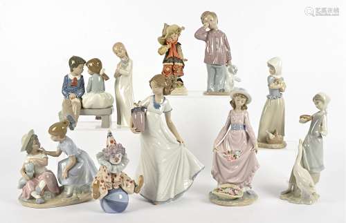 A collection of Lladro and Nao figures, comprising a Lladro 5813 'Having A Ball', 5027 'Flower