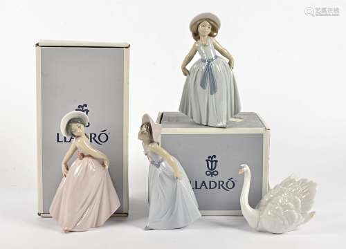 Four Lladro figures, comprising 6175 'White Swan', 6276 'Iris', 6274 'Daisy' and 6275 'Rose', all in