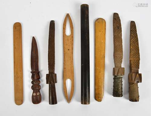 Three 19th Century Lloyd Loom thread tappers, with carved decoration, together with a small