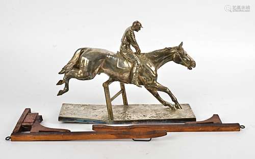 After Fritz Diller (1875-1945) a silver plated model of a horse and jockey clearing a hurdle,