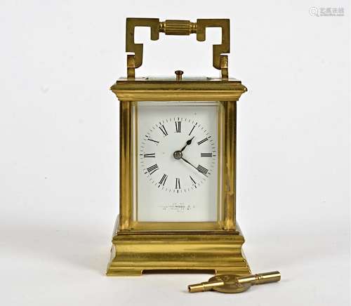 A late 19th Century French brass carriage clock, white enamel dial with Roman numerals, inscribed '