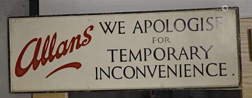 A large mid 20th Century wooden painted sign for Allans stating 'We apologise for temporary