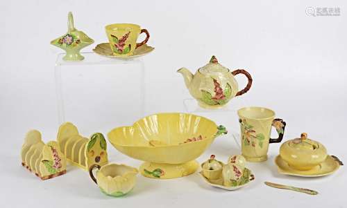 A quantity of Carlton Ware predominantly in the yellow colourway with floral decoration, to