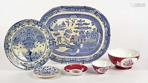 A large Russian bowl and smaller bowl on stand, decorated with flowers upon a red ground, together