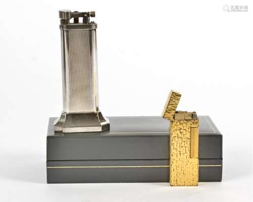 A Dunhill lighter, freestanding and boxed, height 10cm, together with another Dunhill lighter (2)