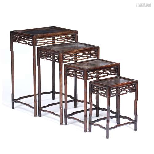 Nest of four hardwood tables Chinese, circa 1900 each with an open fretwork frieze of key form 50