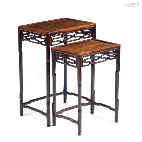 Nest of two hardwood tables Chinese, circa 1900 each with a stylised carved key frieze 43 x 32cm,