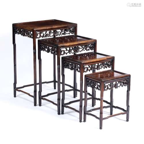 Nest of four hardwood tables Chinese, 19th Century each with carved foliate frieze largest 51cm x