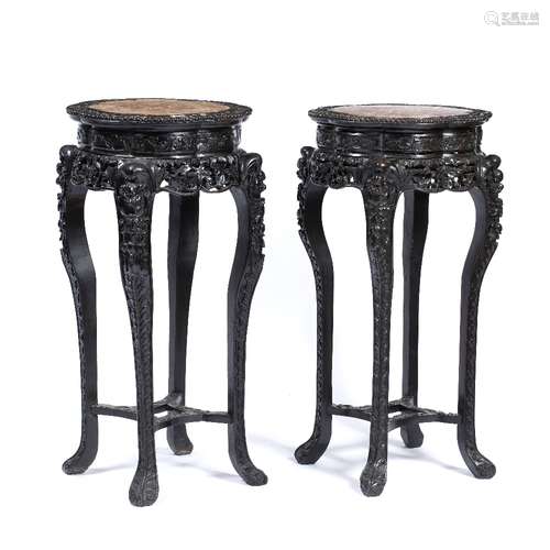 Two similar hardwood stands Chinese, late 19th Century each with inset rose marble tops and