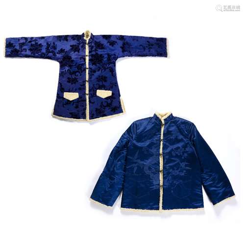 Two astrakhan wool coats Chinese both with a blue lining, one with foliate patterns to the outside