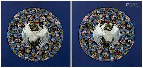 Pair of circular embroidered panels Chinese, 20th Century decorated with a central peacock in flight