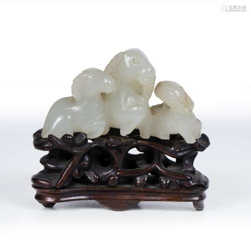 White jade pebble Chinese, 19th-20th Century pierced and carved as a group of goat and two young, on