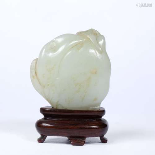 Mutton fat jade pebble Chinese, 18th Century carved as a bat and peach with wood stand 4cm x 4.5cm