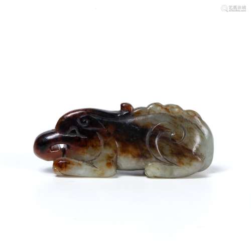 Striated jade carved pendant Chinese, 18th Century in the form of a crouched temple dog carved in