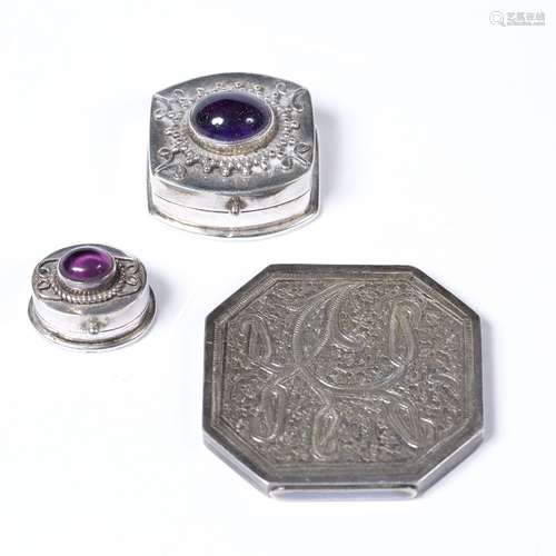 Two white metal pill boxes Chinese with amethyst cabochons inset to the top, each with indistinct