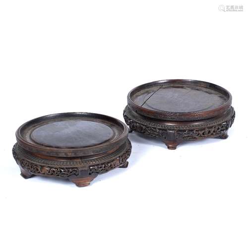 Pair of wooden stands Chinese, 19th century carved to the lower tier with pierced foliate design,