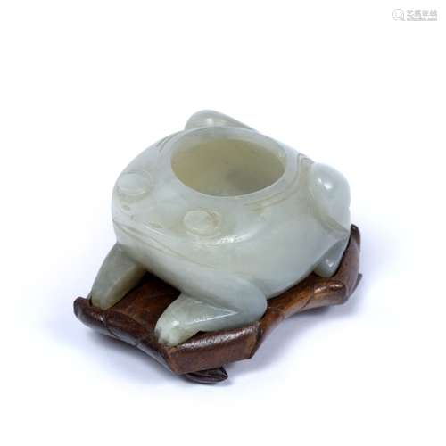 Mutton fat jade brush washer Chinese, 19th Century carved as a squatting toad with fitted wood stand