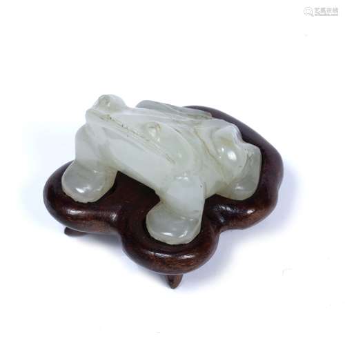 White miniature jade pebble Chinese carved as a squatting four legged toad, on fitted wood stand