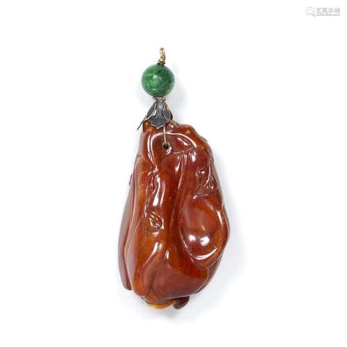 Opaque rust brown amber pendant Chinese carved as a fish and lotus plant with attached metal and