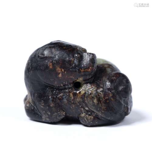 Black and grey mottled jade pebble pendant Chinese carved as a recumbent Buddhist lion looking