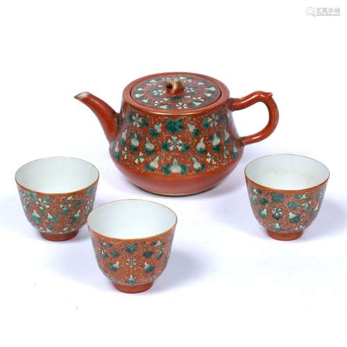 Porcelain tea set Chinese, 9th Century decorated in ground coral red, with melons painted around the