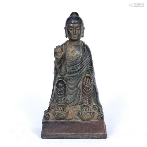 Bronze figure of Buddha Chinese, 17th/18th Century in traditional robes with one raised hand,
