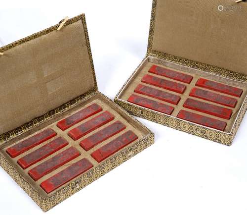 Cased set of 16 ink stones Chinese decorated in red, carved depicting terrace scenes to one side,