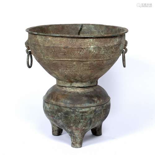 Bronze steamer Chinese, Han dynasty with taotie designs around the outer edge and with ring handles,