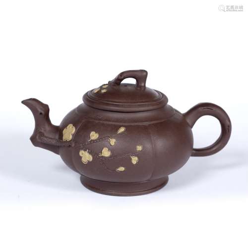 Yixing teapot Chinese, early 20th Century with raised blossom and with circular seal mark 21cm long,