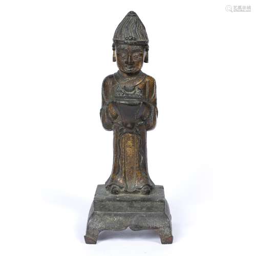 Bronze figure of a Daoist priest Sino-Tibetan, late Ming standing holding a vessel containing ash