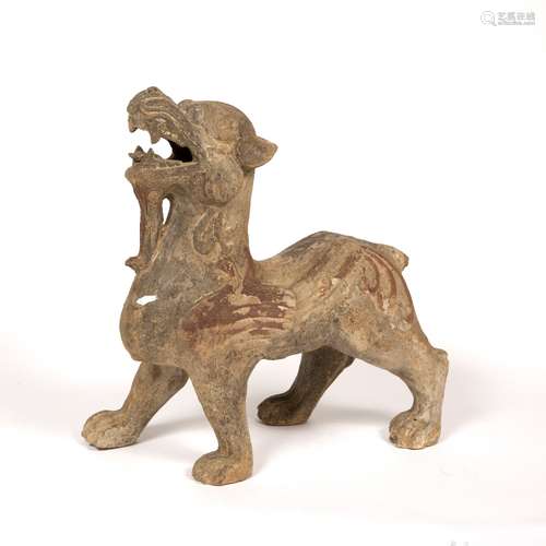 Pottery standing lion guardian Chinese, Han dynasty part painted and open mouthed, facing forward