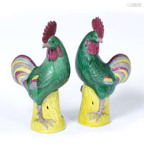 Pair of cockerels Chinese, 20th Century each bird facing forward on a yellow ground base 36cm high