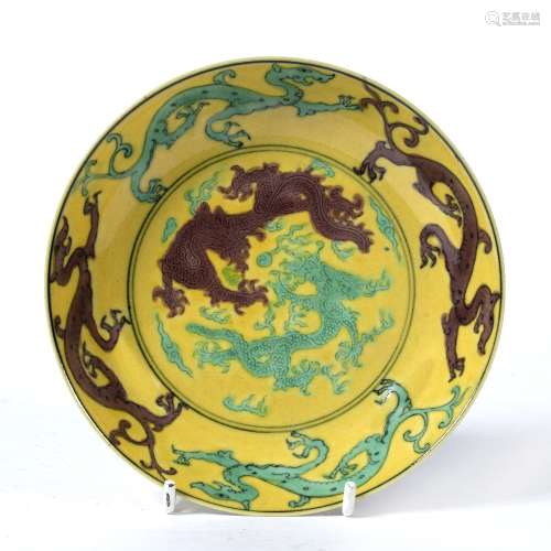 Yellow dragon saucer dish Chinese painted with aubergine and pale green dragons, Yongzheng