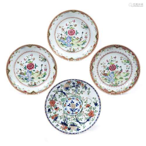 Three famille rose large saucer dishes Chinese, circa 1800 painted with a garden scene of birds,