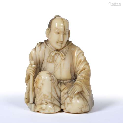 Well carved okimono of a priest Japanese, Mid Meiji dressed in long floral decorated robes while