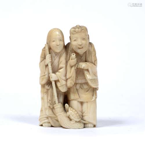 Carved ivory okimono Japanese, Meiji period in the form of two standing figures, one holding a