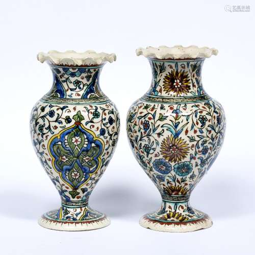 Pair of polychrome pottery vases Qajar each with wavy rim 19.5cm high