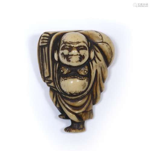 Ivory netsuke of Hotei Japanese, Edo Period carrying his sack over his right shoulder while standing