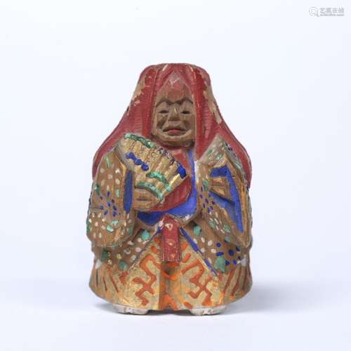 Nara-bori polychromed netsuke Japanese, late Meiji of a standing figure of Shojo holding a fan