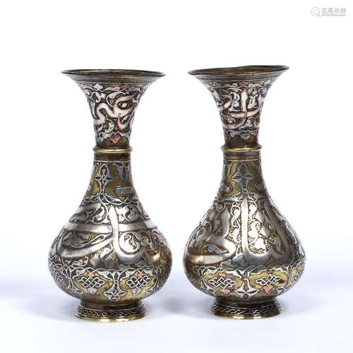 Pair of silver and copper inlaid brass Cairoware vases Syria, 19th/20th Century decorated to the