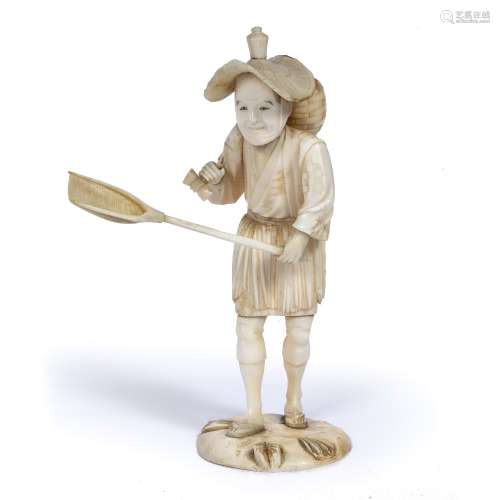 Ivory okimono Japanese, late Meiji in the form of a fisherman standing holding his net in his left