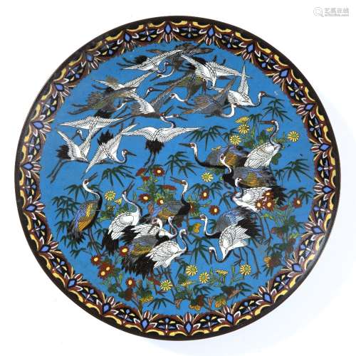 Cloisonne circular plaque, Nagoya Japanese, circa 1880-85 decorated with a flock of cranes among