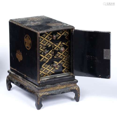 Lacquer small cabinet on stand, Kodansu Japanese, Meiji painted in hiramake with mons to the door