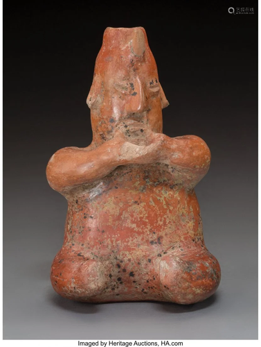 70629: A Colima Seated Figure Height: 8 ½…