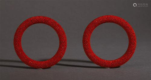 PAIR OF CHINESE CORAL BEAD BANGLES