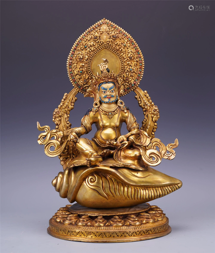 TIBETAN GILT BRONZE SEATED GOD OF…