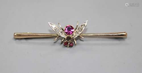 A Victorian 9ct, garnet and diamond set bug bar brooch, 54mm, gross weight 3.3 grams. Condition: