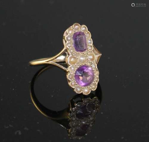 An early to mid 20th century 9ct, amethyst and seed pearl set double cluster dress ring, size O,