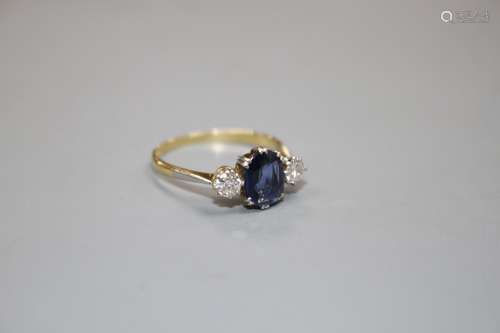 An 18ct and Plat, sapphire and diamond set three stone ring, size O/P, gross weight 2.3 grams.